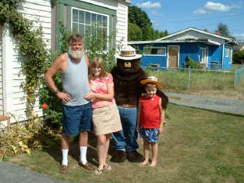 Picture of Curtis, Arielle, Noah, and Smokey Bear